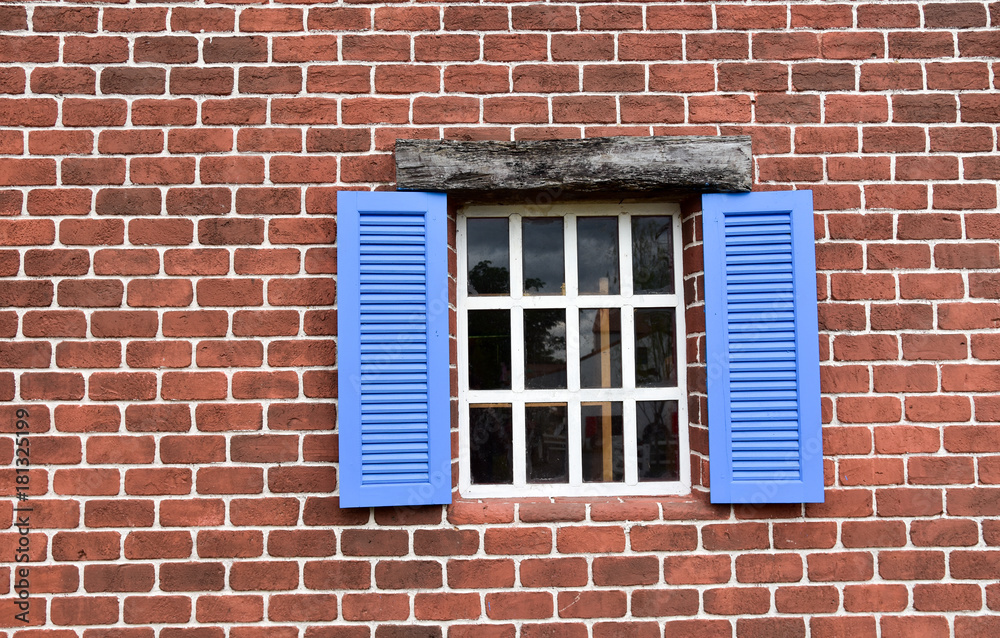 Brick wall pattern and iron anchor plate on an old building