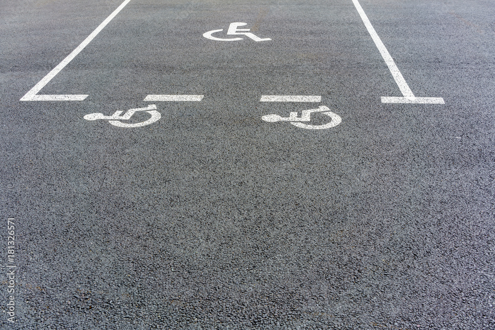 Handicapped parking sign on asphalt reserved in the rest area