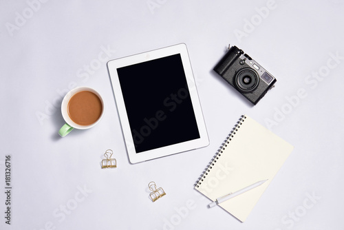 Digital tablet with blank screen on white background. View from above
