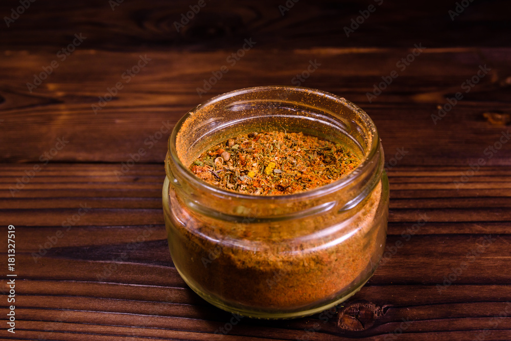 Mix of different seasonings in glass jar Mix of different seasonings in glass jar