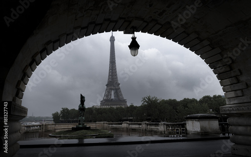 Arch of Eiffel Tower, Paris captured from Bir-Hakeim Bridge crossing River Seine © Alexandre Rotenberg