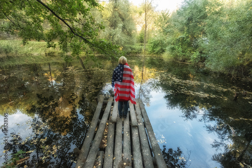 woman with the united states flag on the dock