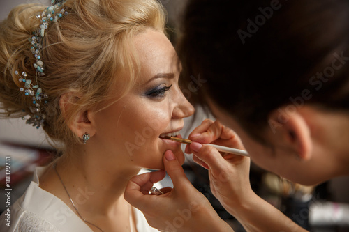 Wedding makeup. Makeup artist made makeup for beautiful bride at wedding day