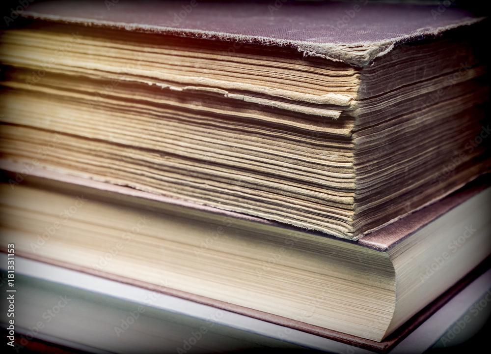 Several old books with pages worn stacked, conceptual image Several old books with pages worn stacked, conceptual image