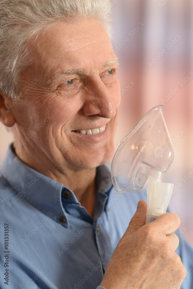 Senior man with inhaler Senior man with inhaler