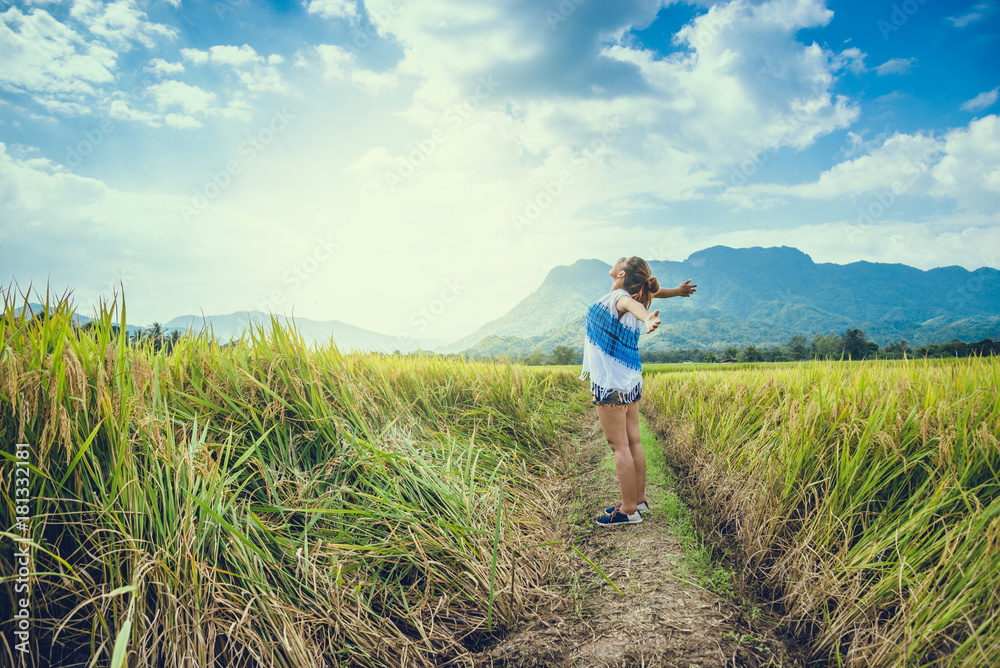 Asian women travel relax in the holiday. Stand natural touch mountain field. Thailand Asian women travel relax in the holiday. Stand natural touch mountain field. Thailand