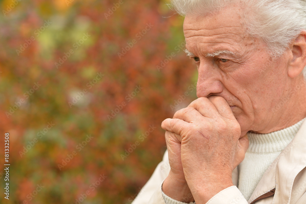 thoughtful senior man in park thoughtful senior man in park