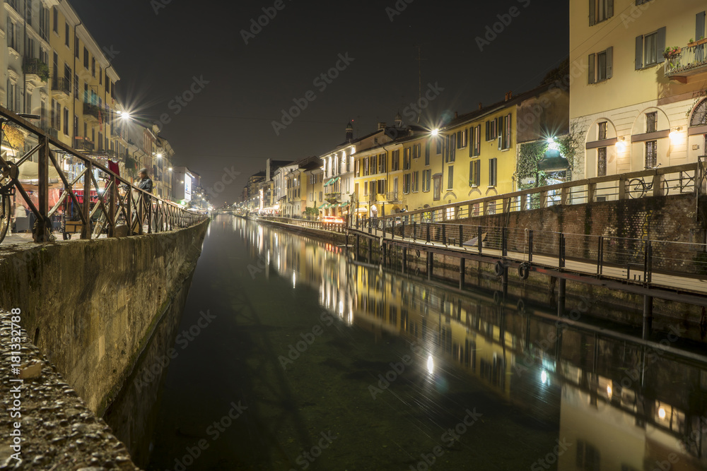 Milan, Italy: the Naviglio Grande canal waterway at evening. This district is famous for its restaurants, cafes, pubs and nightlife.