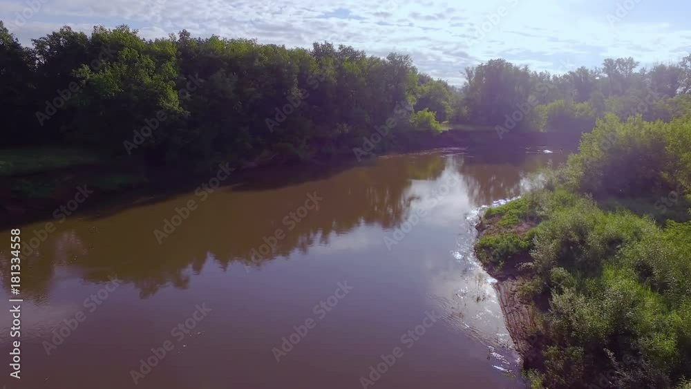 AERIAL: Turn the river with muddy water. Beautiful morning landscape, reflection of the sun and clouds in the water. AERIAL: Turn the river with muddy water. Beautiful morning landscape, reflection of the sun and clouds in the water.