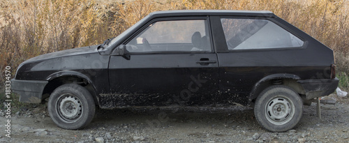 Old black car side view. Old hatchback. Retro car