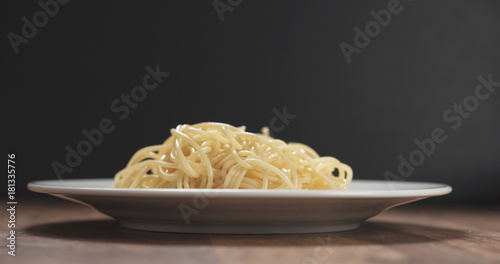 spaghetti on white plate on table