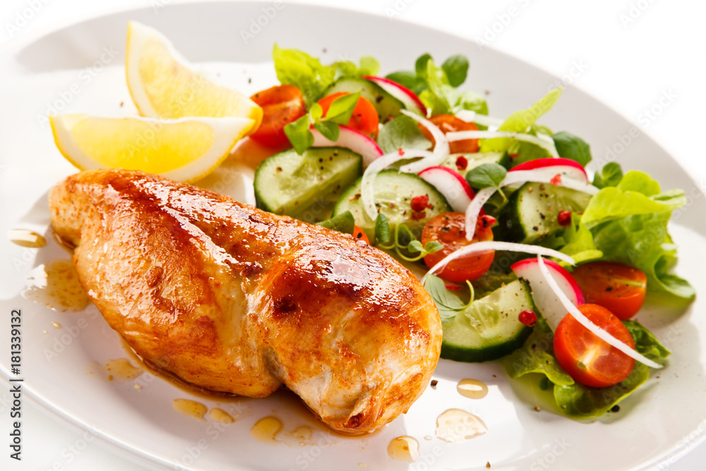 Grilled chicken fillet on white background Grilled chicken fillet on white background