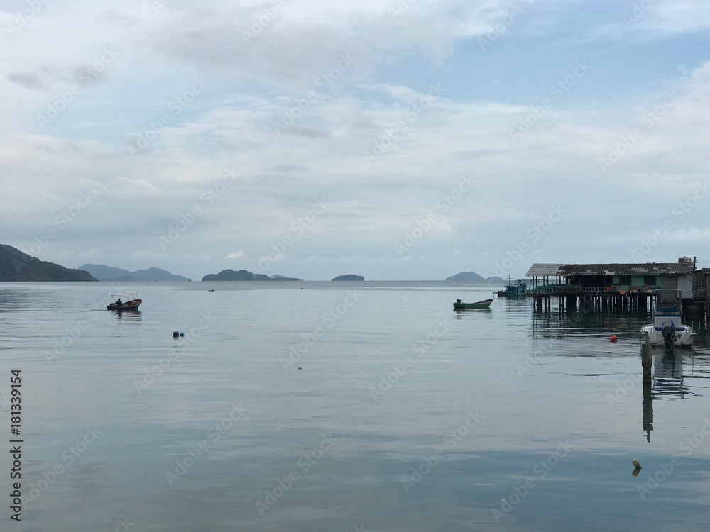 Small boat passing by at Bang Bao Bay