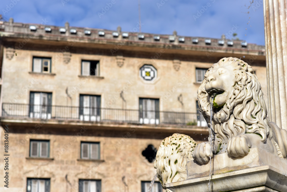 Lion Fountain (Fuente de los Leones) and historical buildings at Plaza de San   Francisco, Old Havana, Cuba