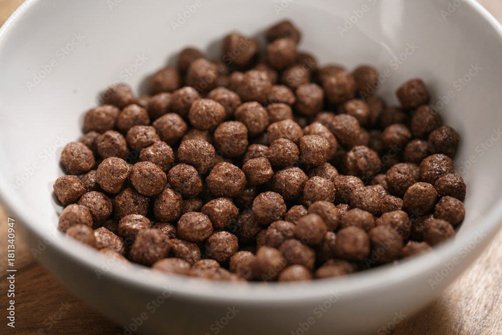 chocolate cereal balls in white bowl for breakfast chocolate cereal balls in white bowl for breakfast