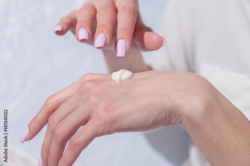 Fototapeta premium woman hands with cream