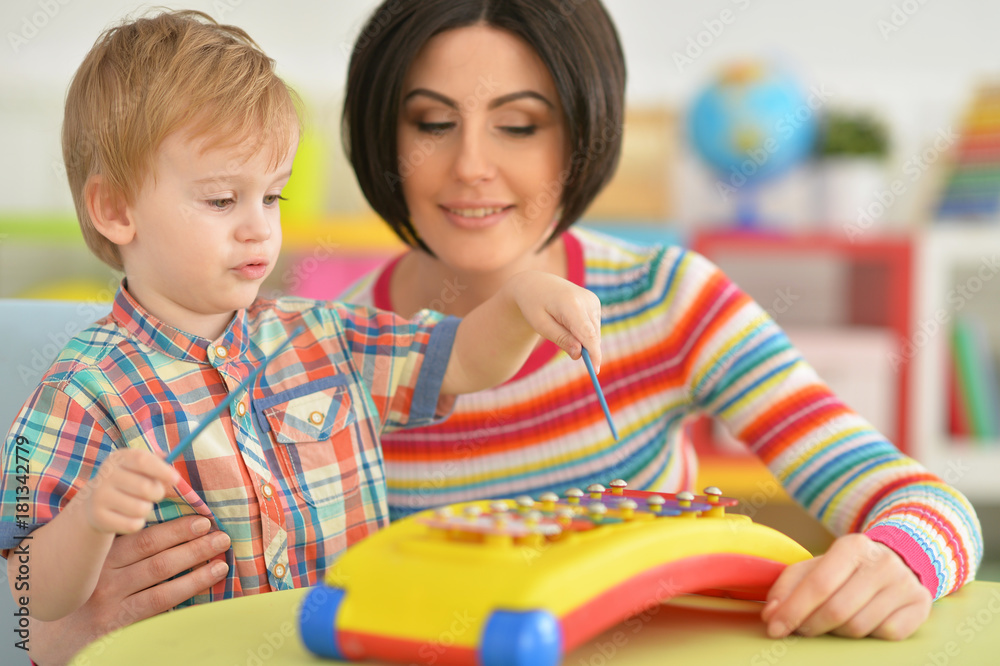 Young mother playing with son Young mother playing with son