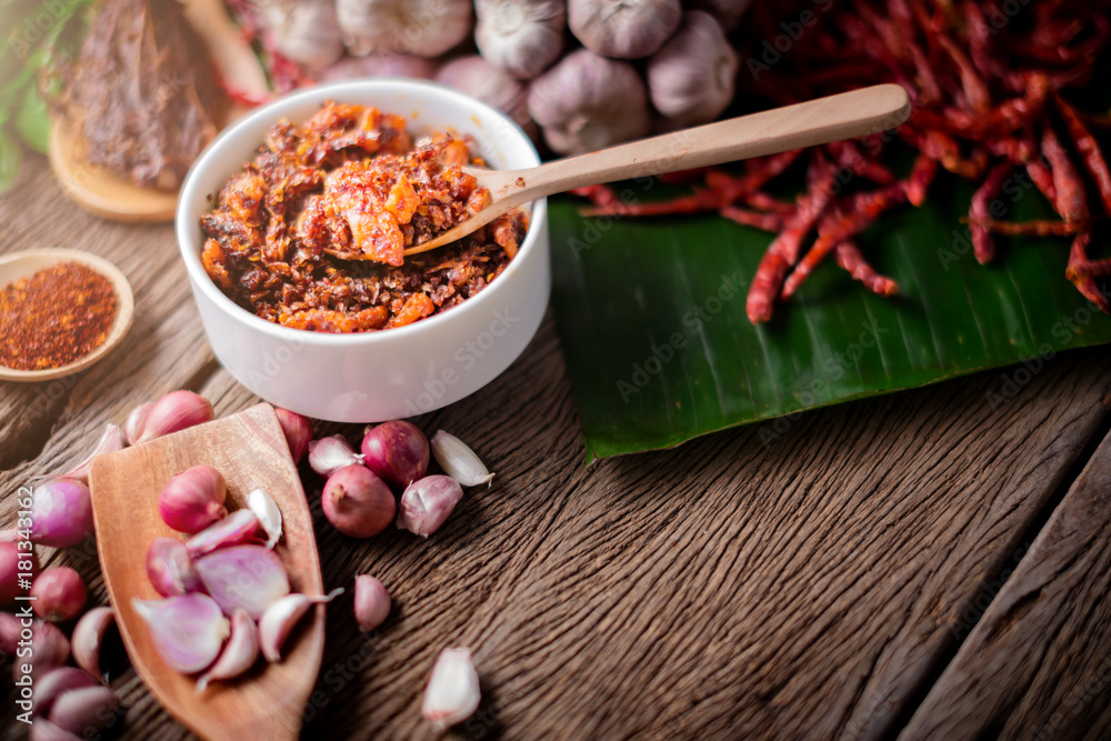thai tradition style spicy dipping mad frop pork and shirmp with spicy and herb for ingredient on wooden texture table
