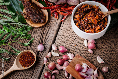 thai tradition style spicy dipping mad frop pork and shirmp with spicy and herb for ingredient on wooden texture table photo