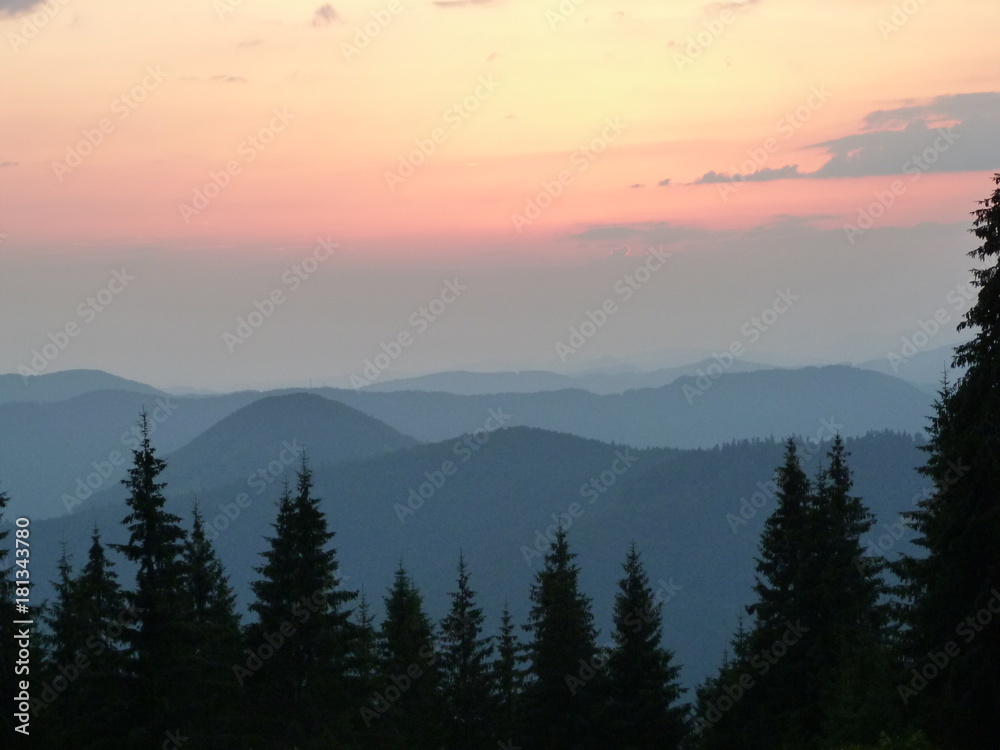 sunset over the mountain forests of the Ukrainian Carpathians.