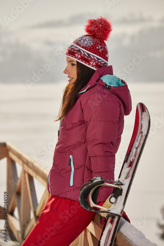 Sexy snowboarder woman outdoors. Winter resort