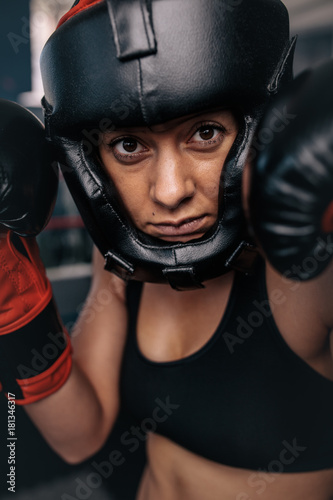 Female boxer geared up for a bout