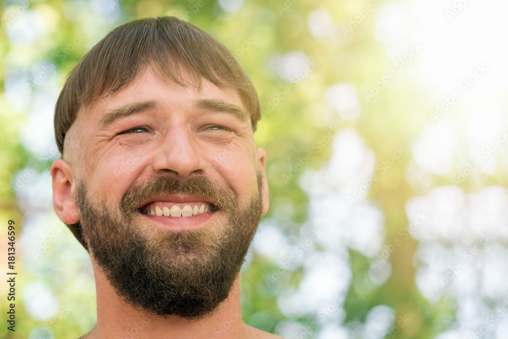 Young smiling bearded man with stylish haircut Young smiling bearded man with stylish haircut