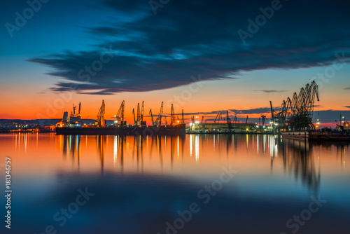 Sunset over sea port and industrial cranes, Varna. Bulgaria
