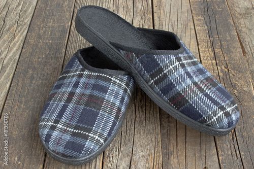 House slippers on wooden floor background