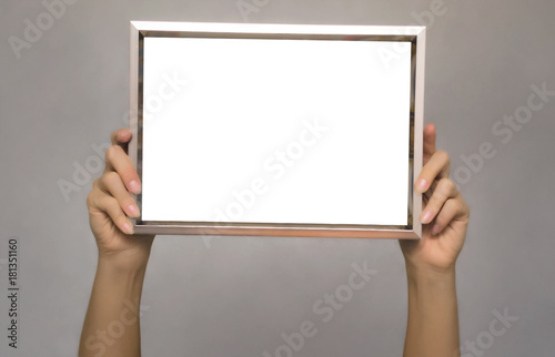 Special offer. Female hands holding empty blank photo frame above a head. Grateful letter. Gratitude concept. Thanks letter.