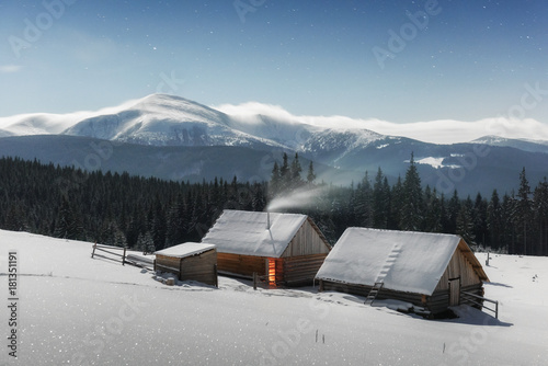 Fantastic landscape with snowy house