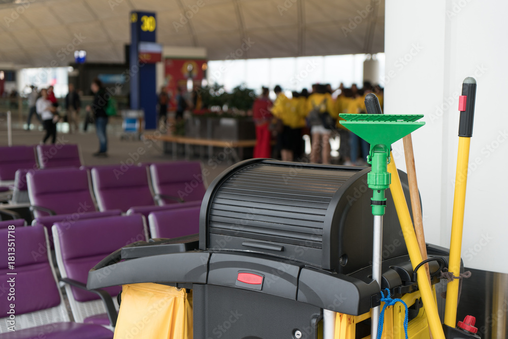 Mop bucket and set of cleaning equipment in international airport with