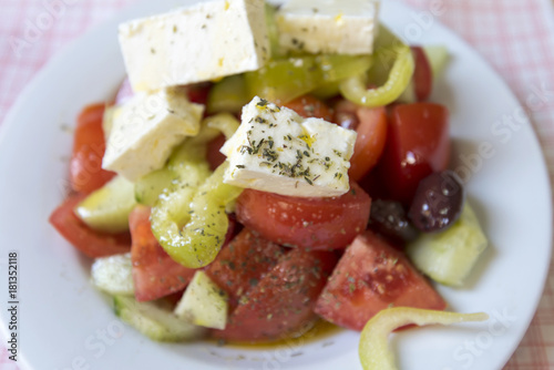 Real Greek salad on the table at a tavern in Greece