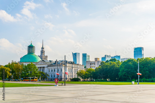 View of the palace of culture and science, the Holy Trinity Evangelical Church of Augsburg Confession and Zacheta National Art Gallery near Pilsudskiego Square in Warsaw, Poland. photo