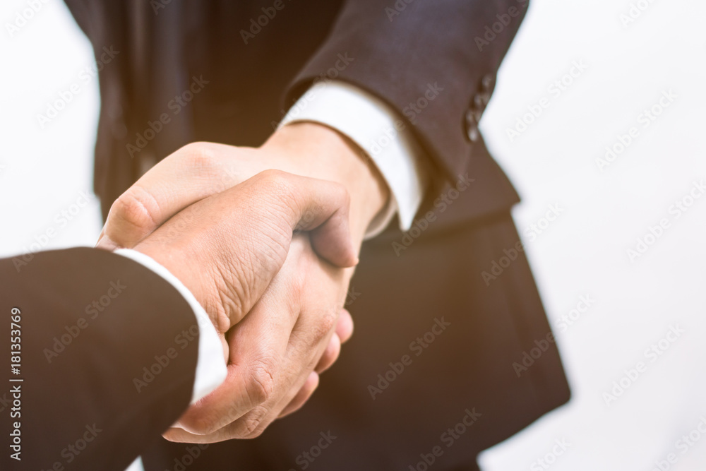 Business concept. Handshake for make agreement in contract of Business. Successful businessmen handshaking after good deal. young businessmen shaking hands on business meeting on white background.