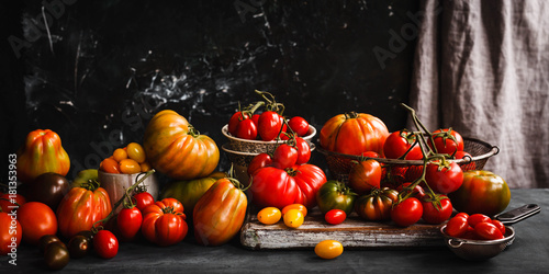 Tomatoes group Ripe abundance tomatoes on a table 