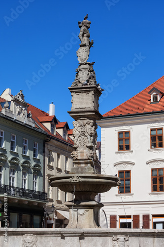 Roland Fountain (Maximilian Fountain) topped by a statue of a knight in Bratislava Old Town, Slovakia, 16th century city landmark