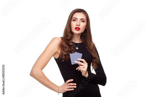 Canvas Print Beautiful confident woman showing poker cards looking at camera with copy place