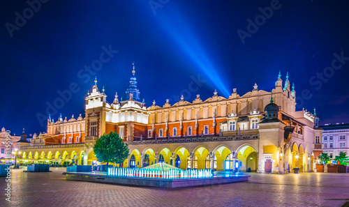 Night view of the rynek glowny main square with the town hall and sukiennice marketplace in the polish city Cracow/Krakow. photo