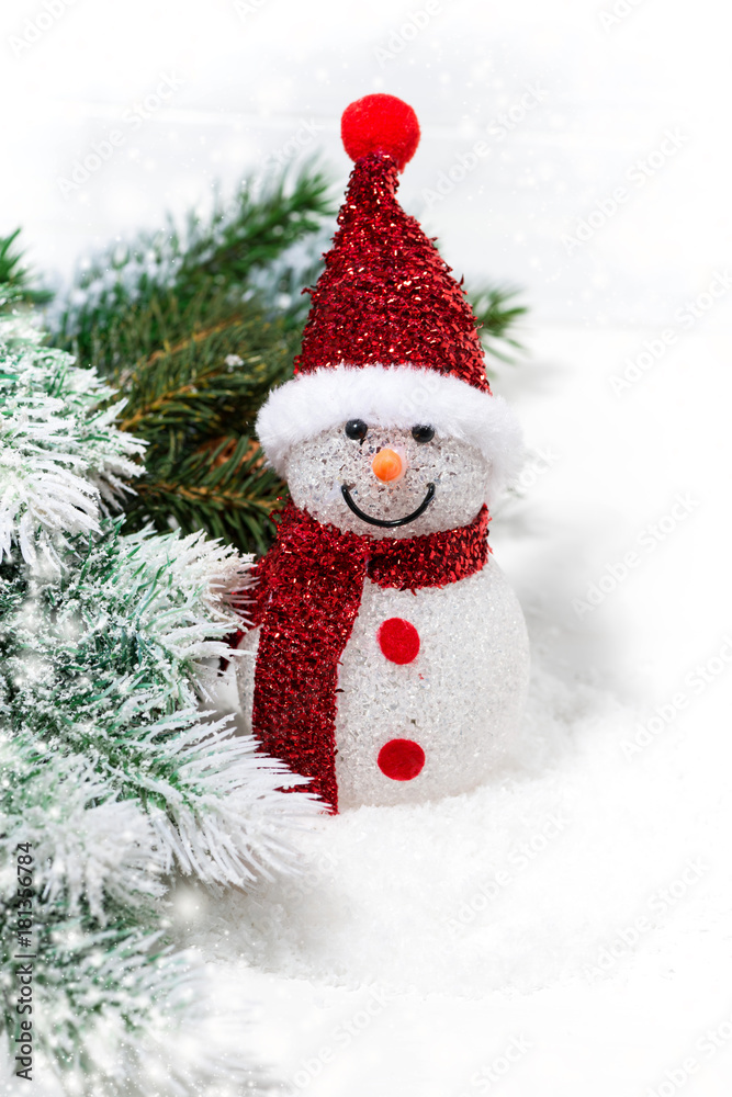 christmas snowman in fir branches on a white background