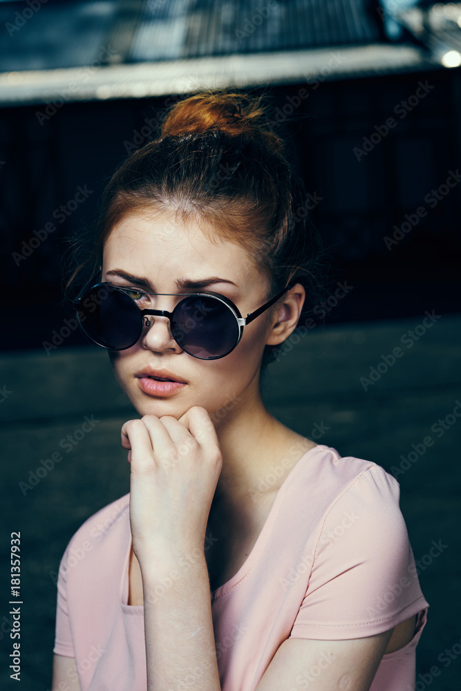 Beautiful young woman in sunglasses on the street, portrait. Beautiful young woman in sunglasses on the street, portrait.