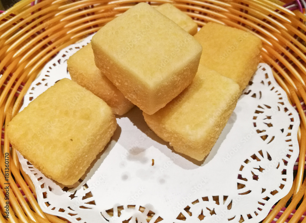 Square shape deep fried tofu in basket