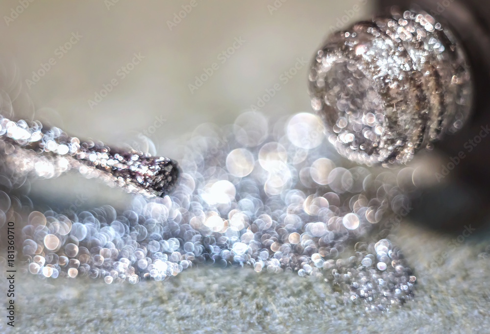 Texture of shiny nail polish shine closeup.a bottle of nail polish next to the brush. Texture of shiny nail polish shine closeup.a bottle of nail polish next to the brush.