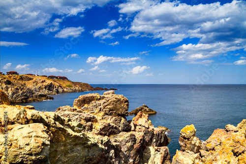 Coastal landscape - the rocky seashore with the village of Sozopolis, near city of Sozopol in Bulgaria