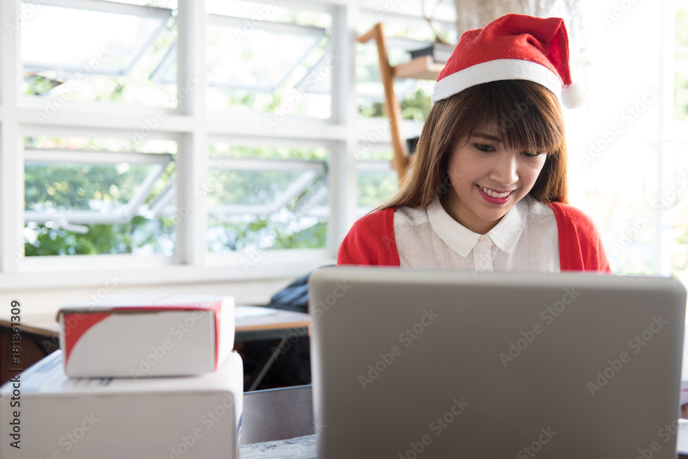 startup small business owner working with computer at workplace. freelance woman seller check product order to prepare for delivery to customer. Online selling, e-commerce, shipping concept startup small business owner working with computer at workplace. freelance woman seller check product order to prepare for delivery to customer. Online selling, e-commerce, shipping concept