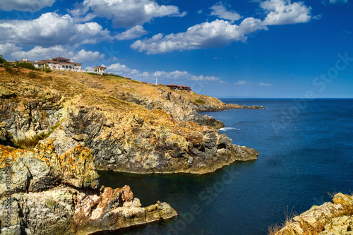 Coastal landscape - the rocky seashore with the village of Sozopolis, near city of Sozopol in Bulgaria