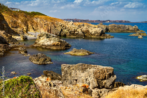 Coastal landscape - the rocky seashore with the village of Sozopolis, near city of Sozopol in Bulgaria