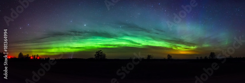 Green arc of aurora borealis in Estonia sky