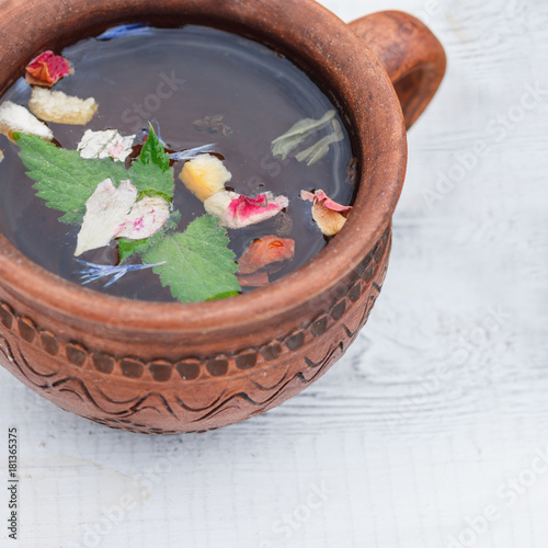 Herbal tea in a clay mug