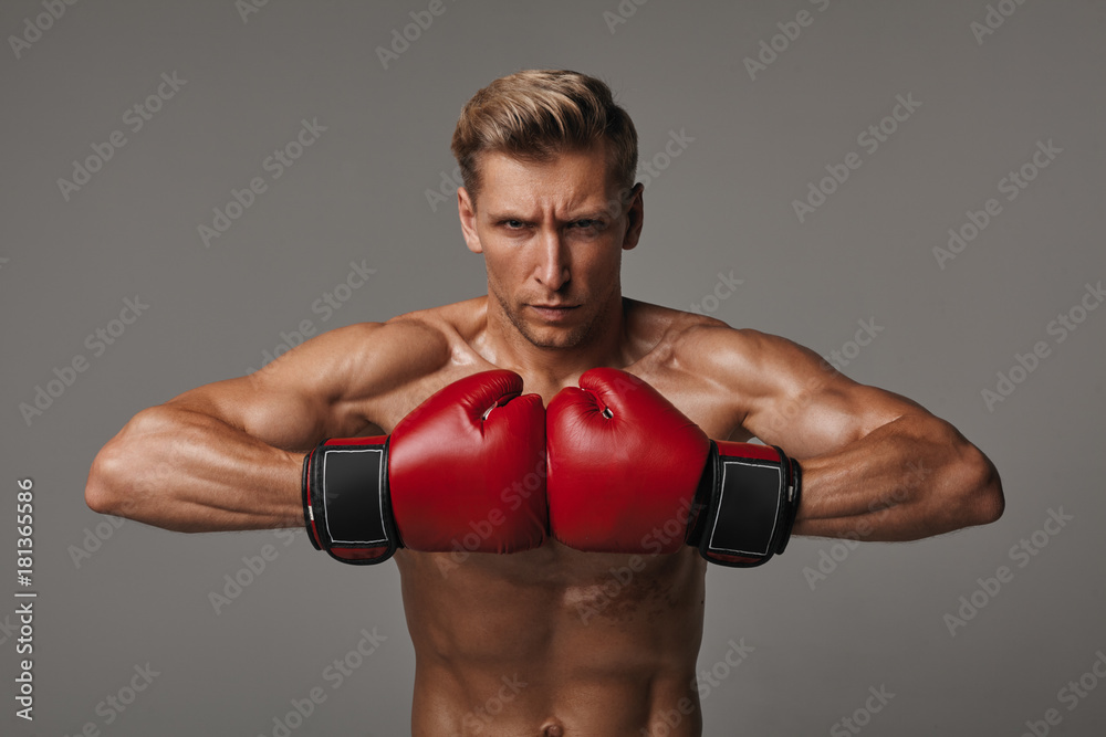 Determined sportsman in red gloves